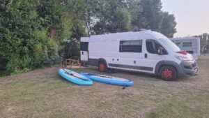 Campervan campsite setup for a family trip